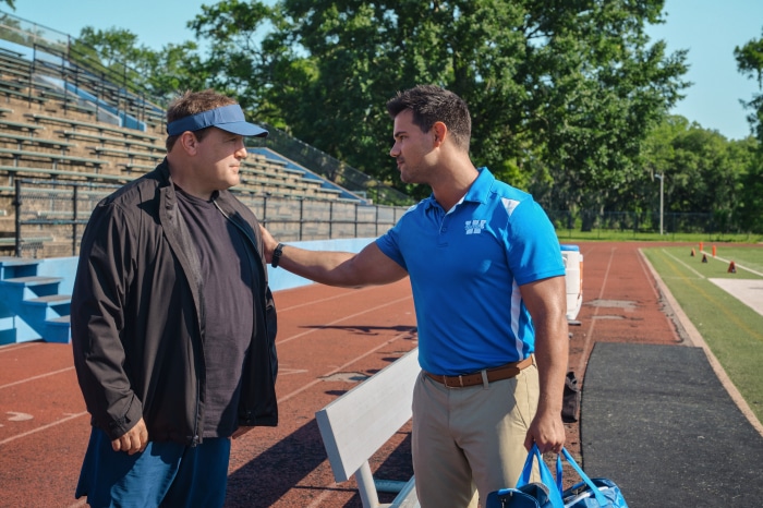 Kevin James and Taylor Lautner on a Football Field