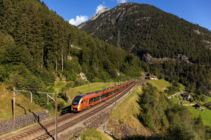 Orange train in the Swiss Alps