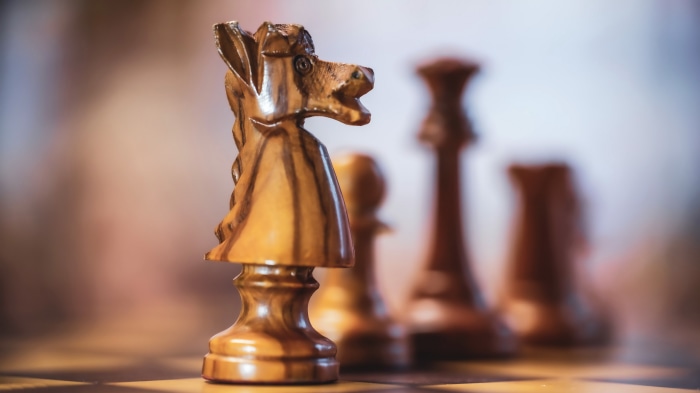 Wooden Chess Knight on a Chessboard 4K