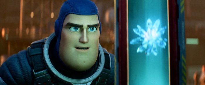 Buzz Lightyear from Lightyear looking at a glowing object
