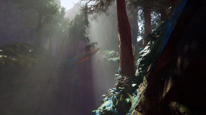 Panther on a log in a sunlit forest