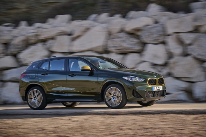 BMW X2 xDrive25e driving on a rocky road