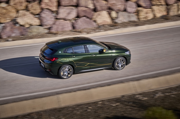 BMW X2 xDrive25e driving on a road