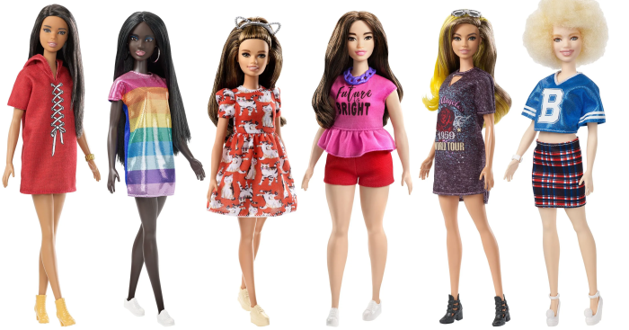 Group of diverse Barbie dolls in fashionable outfits