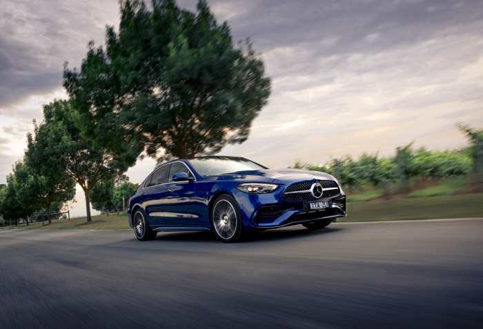 Blue Mercedes-Benz C-Class 4Matic Sedan Driving