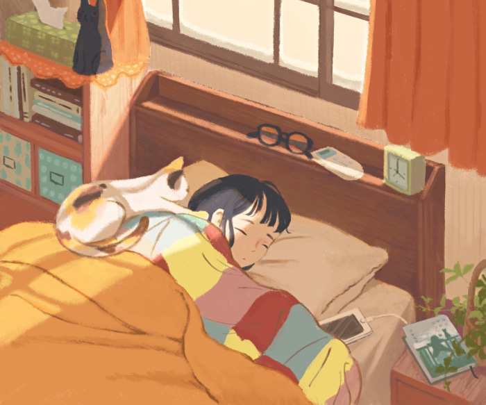 Girl sleeping with cat on bed