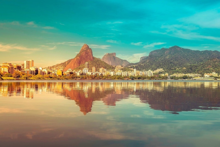 Rio de Janeiro cityscape with mountains and water reflection