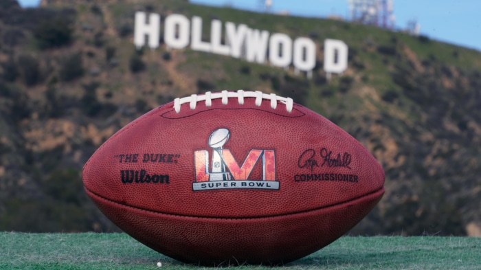 Super Bowl LVI football in front of Hollywood sign