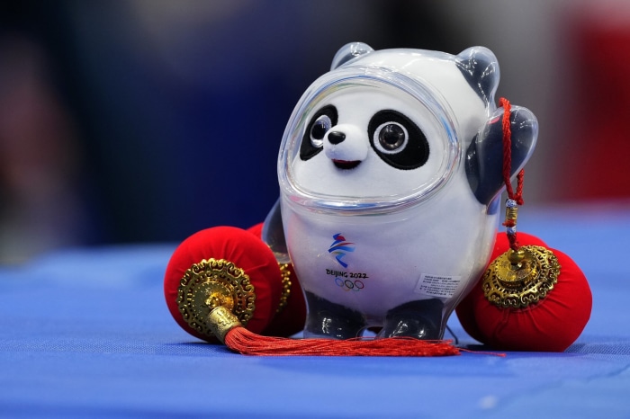 Bing Dwen Dwen mascot with Beijing 2022 logo and lanterns