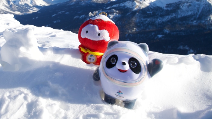 Bing Dwen Dwen and Shuey Rhon Rhon on a snowy mountain