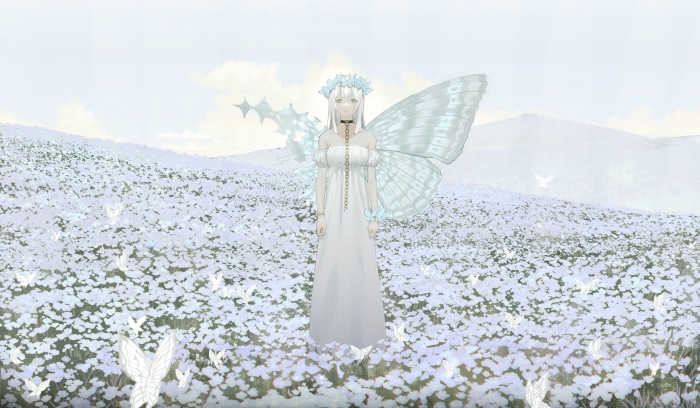 Girl with butterfly wings in a field of flowers