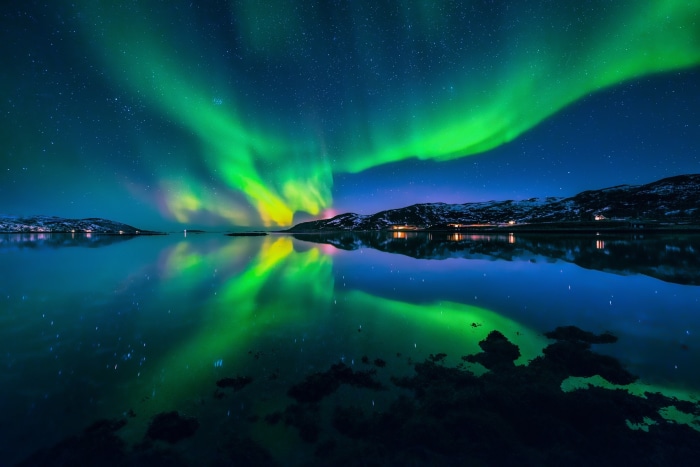 Aurora Borealis over a Fjord at Night