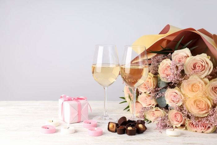 Romantic Valentines Day setting with roses and wine