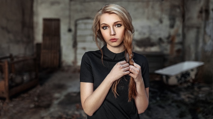 Woman with blonde hair in a black dress