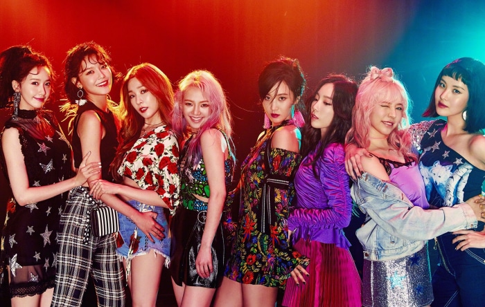 Girls Generation members posing for a photo