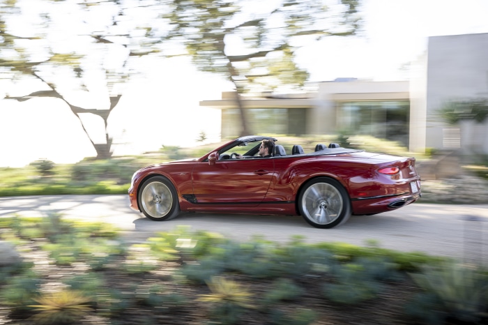 Bentley Continental GT Speed Cabriolet driving on a sunny day