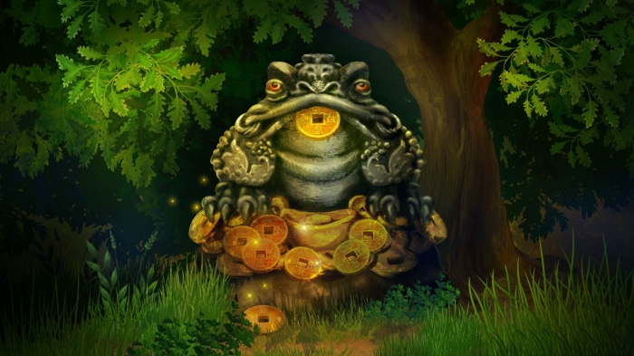 Stone toad statue with coins in a forest