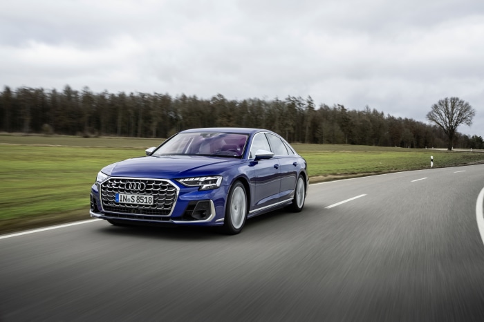 Blue Audi S8 driving on a road