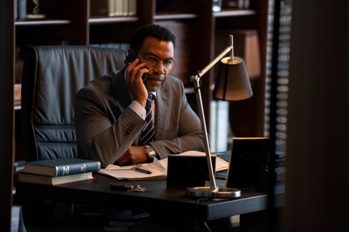 Man in Suit Talking on Phone in Office