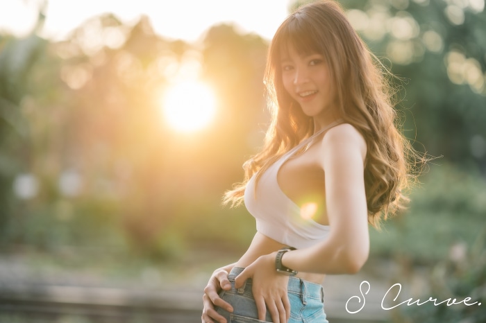 Asian Woman Smiling in Sunset Light