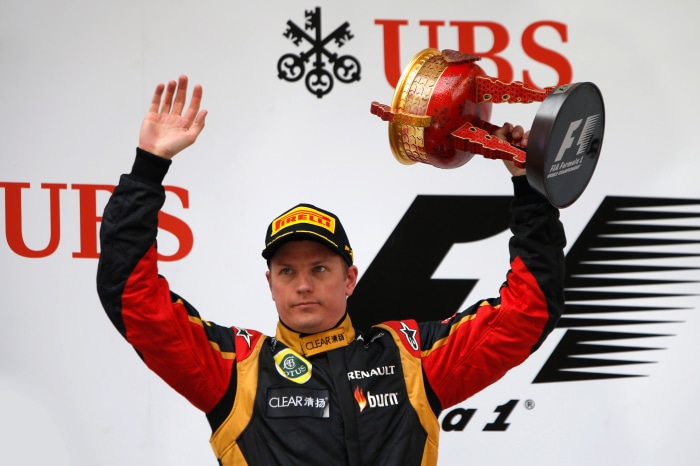 Kimi Räikkönen holding a trophy