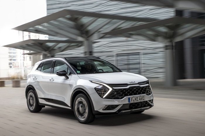 White Kia Sportage GT-Line PHEV SUV driving