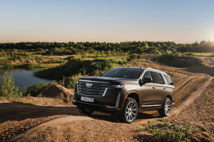 Cadillac Escalade SUV on a dirt road