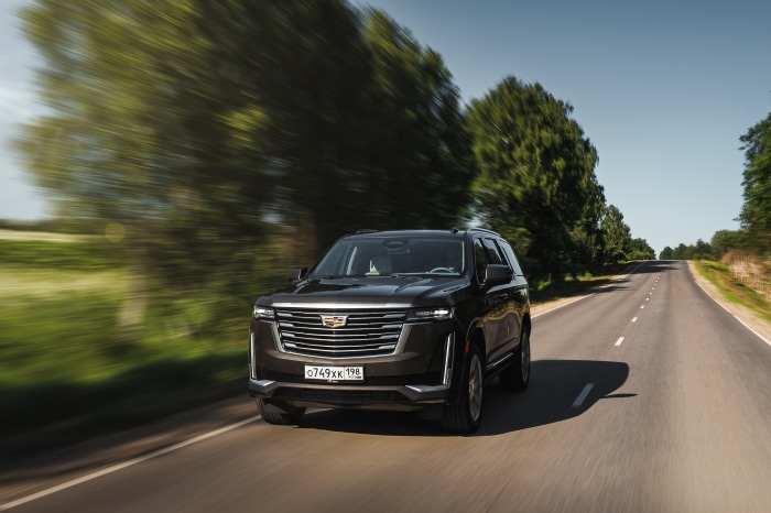Cadillac Escalade 600 4K SUV driving on a road