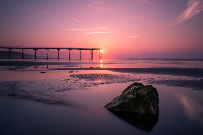 Pier at sunset over the ocean in England