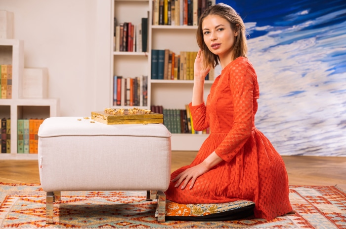 Woman in red dress with backgammon board
