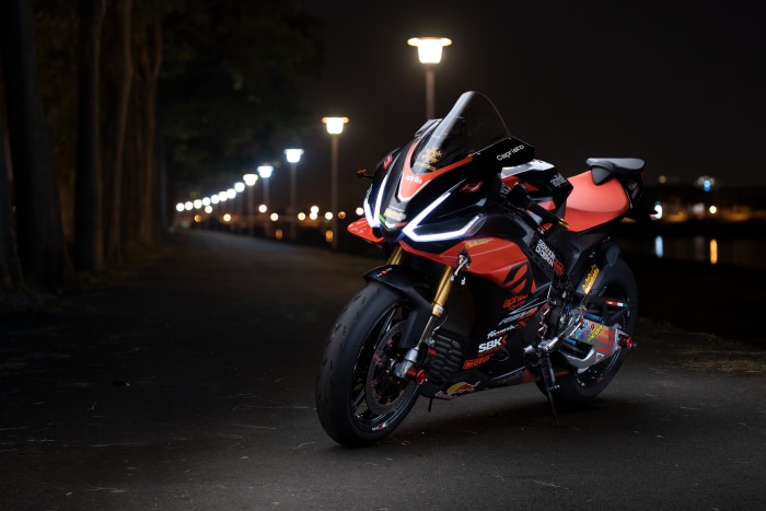 Aprilia RSV4 motorcycle parked at night