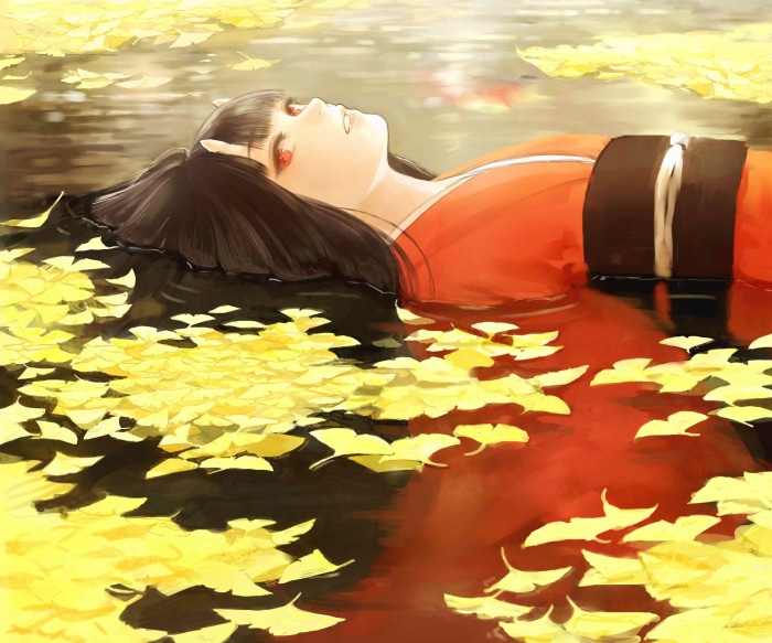 Girl lying in water with yellow leaves