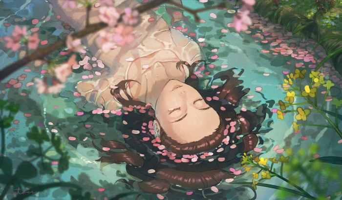Girl floating in water with flower petals