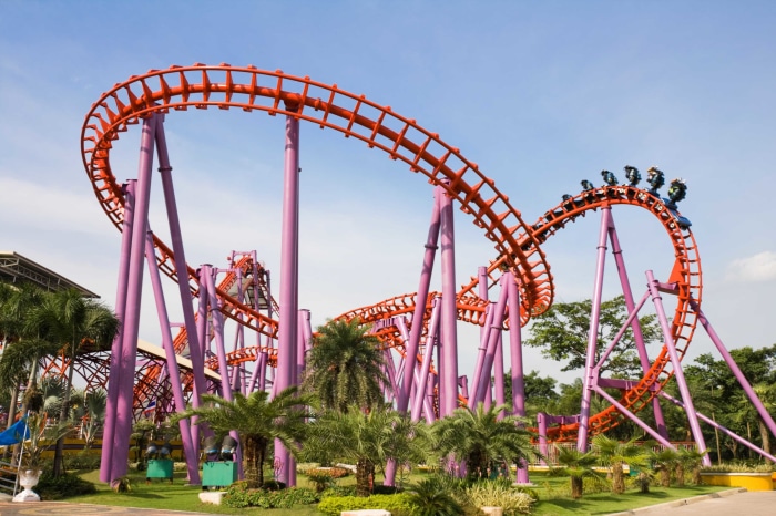 Roller coaster with purple supports and orange track