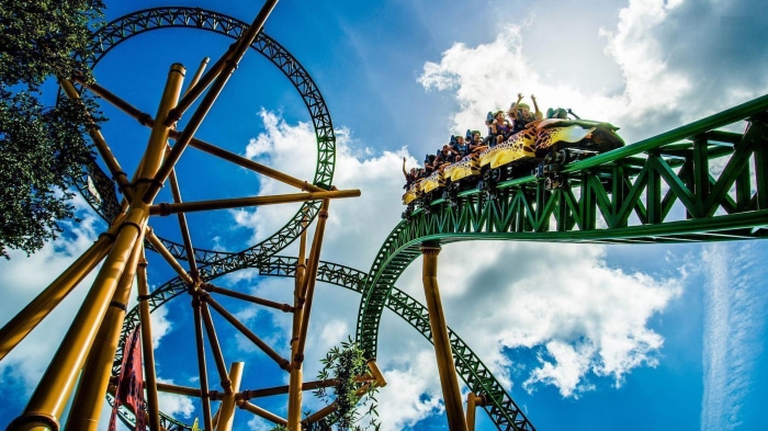 Roller coaster with people riding it