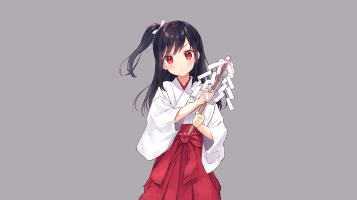 Miko holding a Shide
