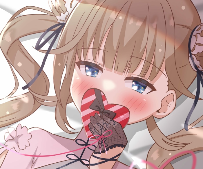 Hanabusa Lisa from VSPO! holding a heart-shaped chocolate