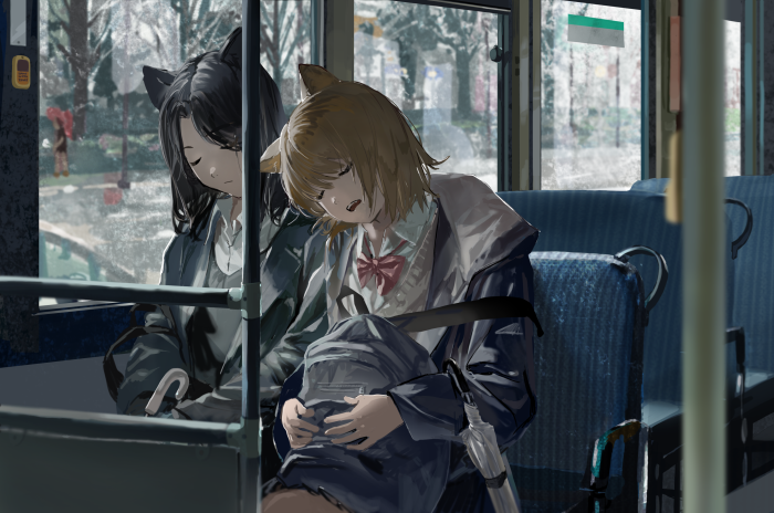 Two girls with cat ears sleeping on a bus