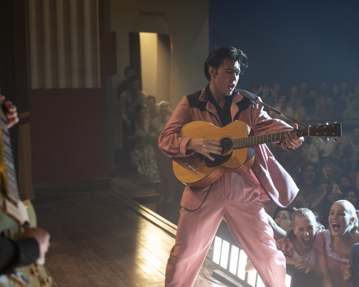 Austin Butler as Elvis Presley performing