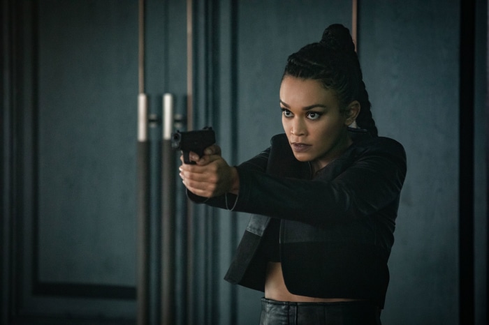 Pearl Thusi holding a gun