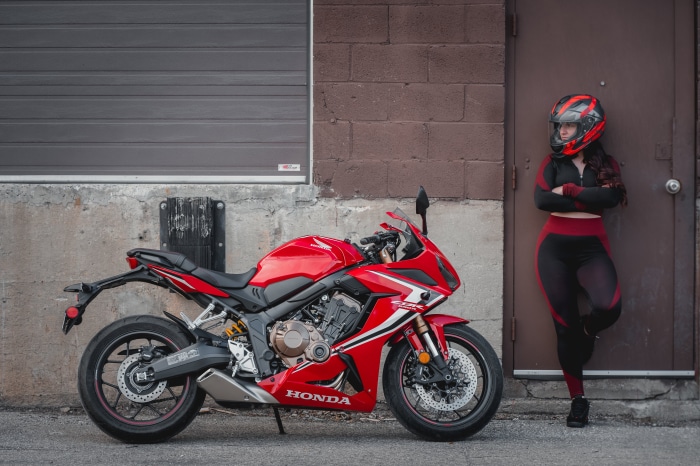 Woman in Motorcycle Gear with Honda CBR650R