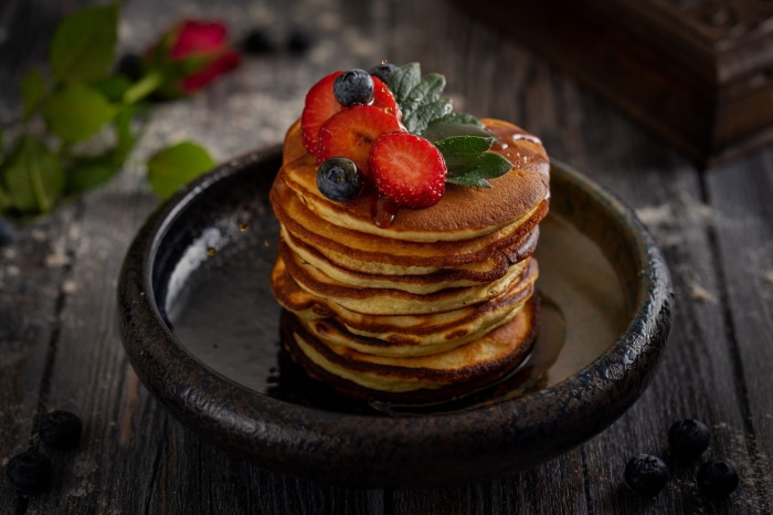 Stack of Pancakes with Strawberries and Blueberries