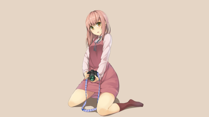 Girl with camera kneeling