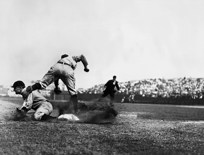 Ty Cobb sliding into third base during a baseball game
