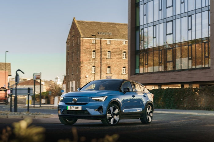 Blue Volvo C40 Recharge electric SUV driving on street