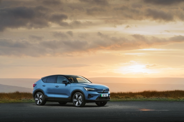 Blue Volvo C40 SUV at sunset