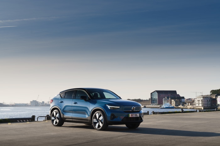 Blue Volvo C40 Recharge electric SUV parked by water