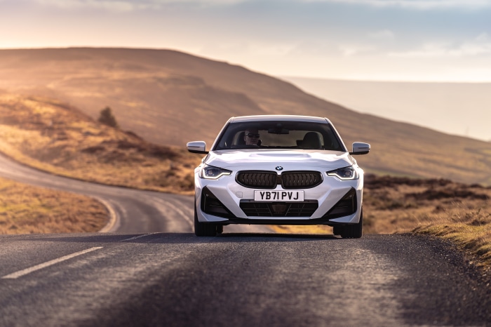 White BMW 220i Coupé M Sport on a road