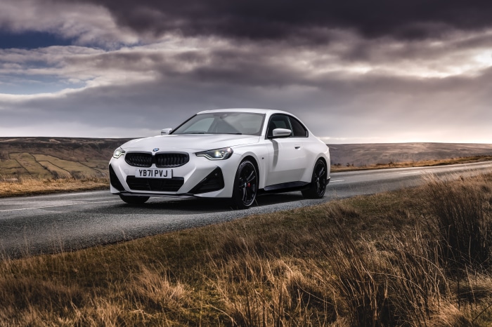 White BMW 220i Coupé M Sport on a road