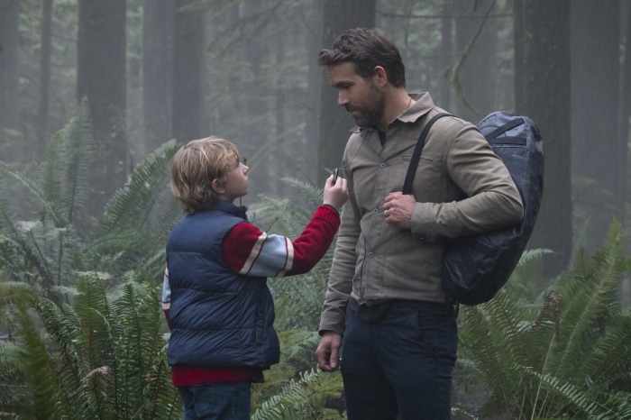 Adam Project Ryan Reynolds and Walker Scobell in forest